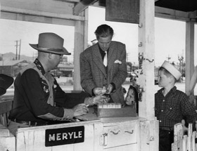 Dan Duryea Buys Amusement Park Tickets for His Sons (1947)