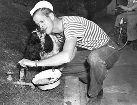 Dan Duryea with his dog, Jerry. (1947)