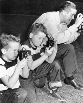 Richard, Peter and Dan Duryea with Their Cameras (1949)